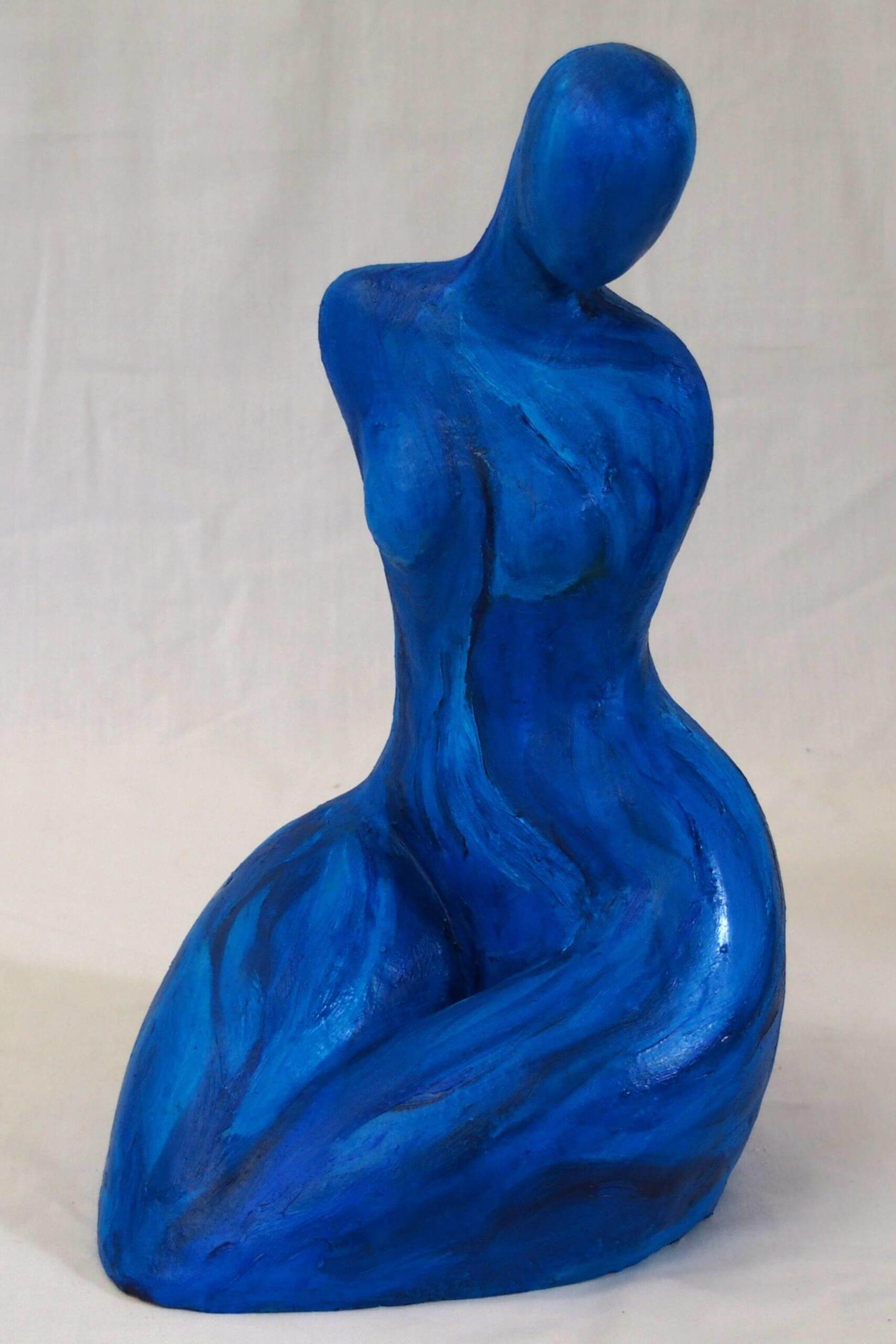 Blue seated Figure, clay sculpture by Robyn Varpins